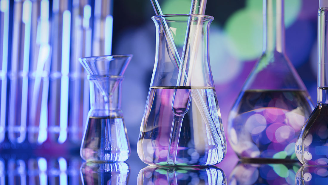 glass beakers with clear chemical liquids in them